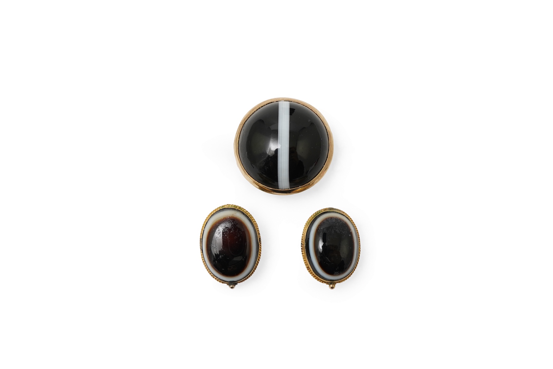 An onyx dress ring and pair of earrings